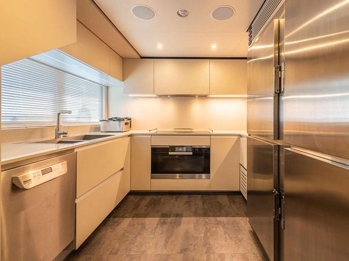 The galley features modern appliances and ample counter space, perfect for gourmet cooking. aboard ON Yacht for Sale