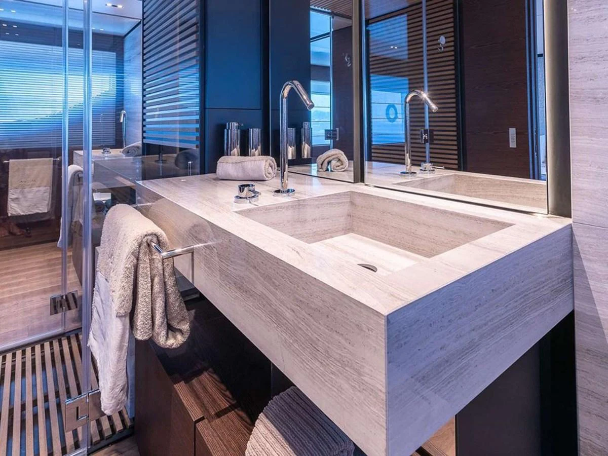 The yacht's bathroom features a sleek, modern design with a spacious vanity and luxurious fixtures. aboard ON Yacht for Sale