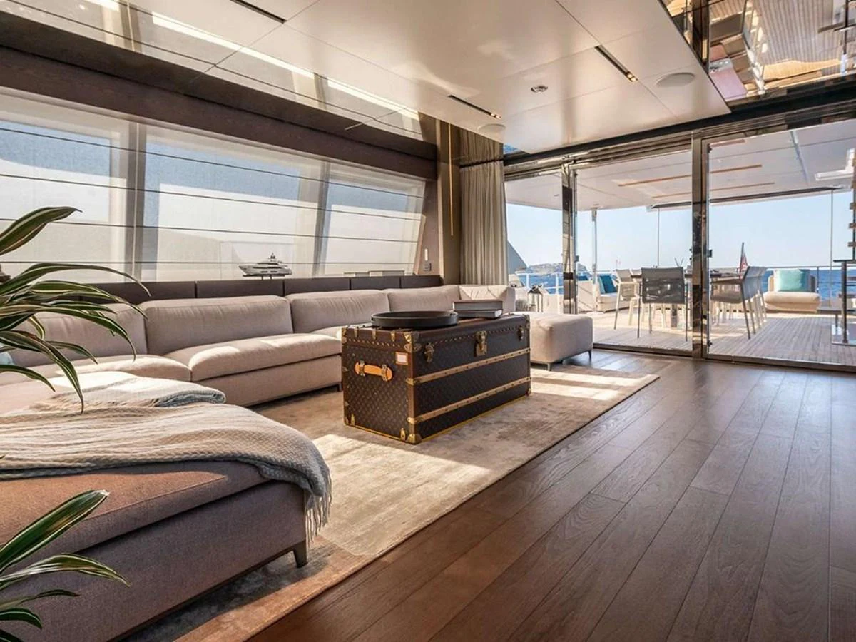 The spacious salon features a luxurious seating area with a view of the aft deck. aboard ON Yacht for Sale