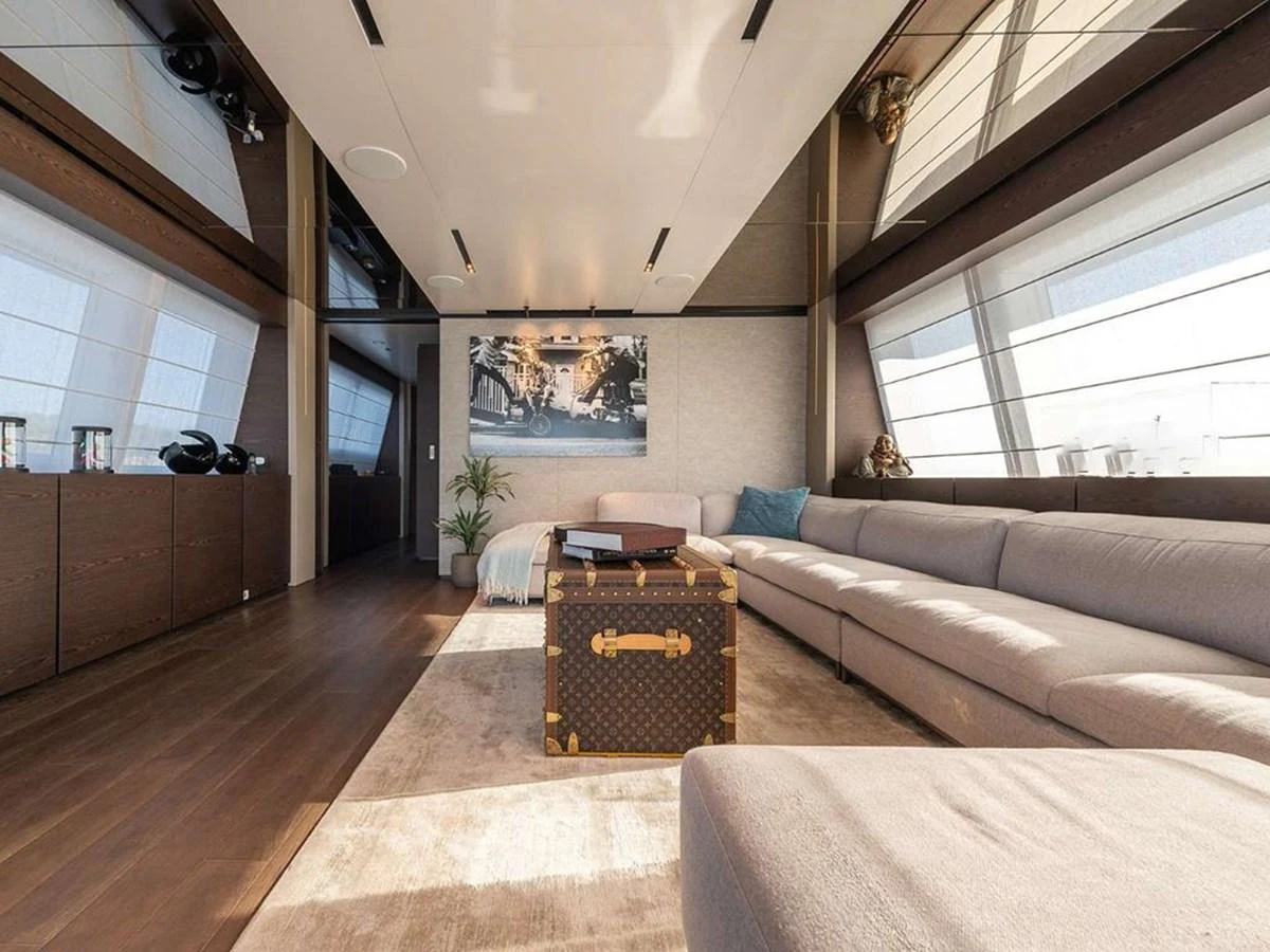 The salon features a spacious and luxurious seating area with modern decor and ample natural light. aboard ON Yacht for Sale