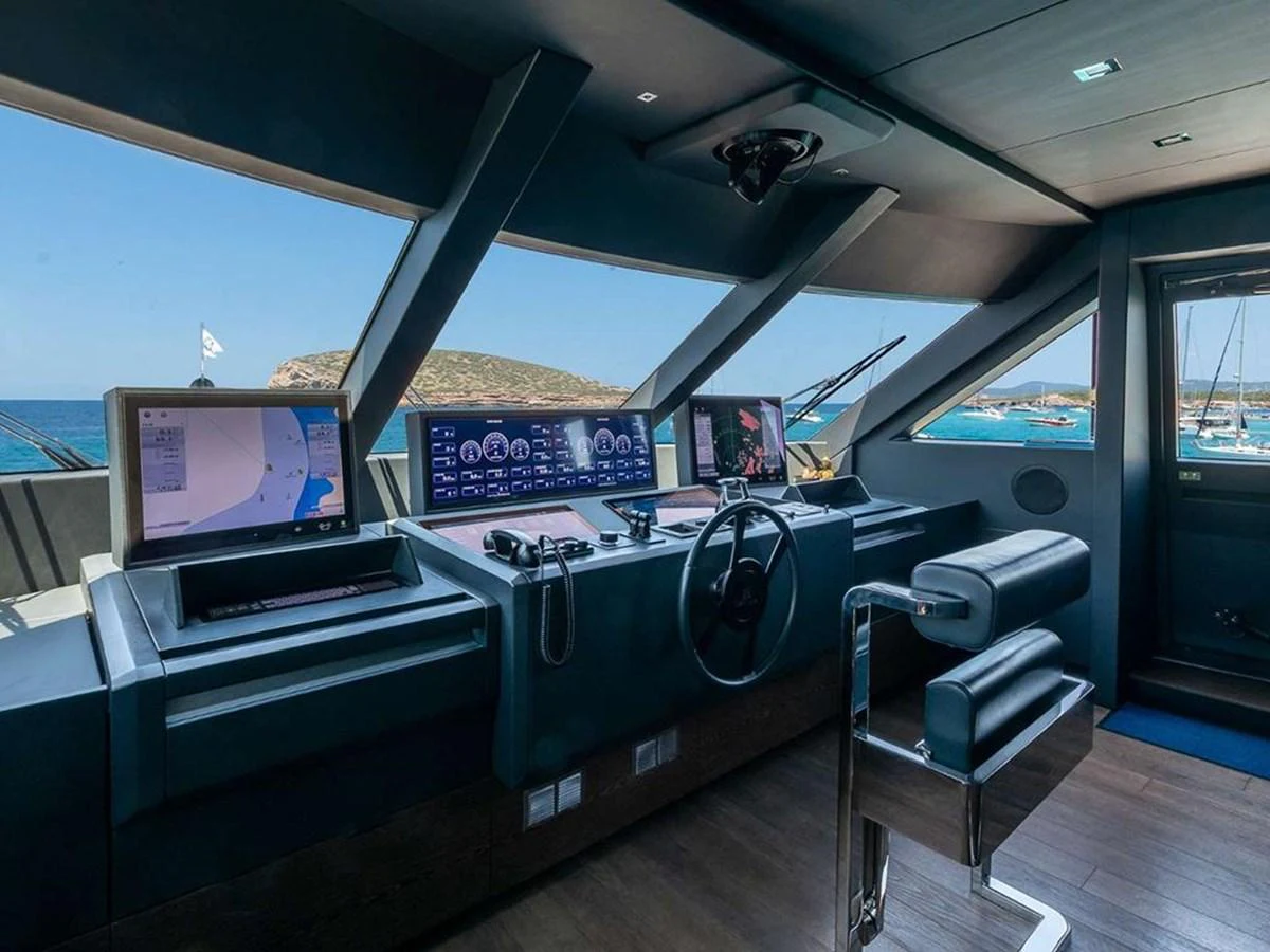 The helm station offers a sleek and modern command center with advanced navigation equipment and panoramic views. aboard ON Yacht for Sale