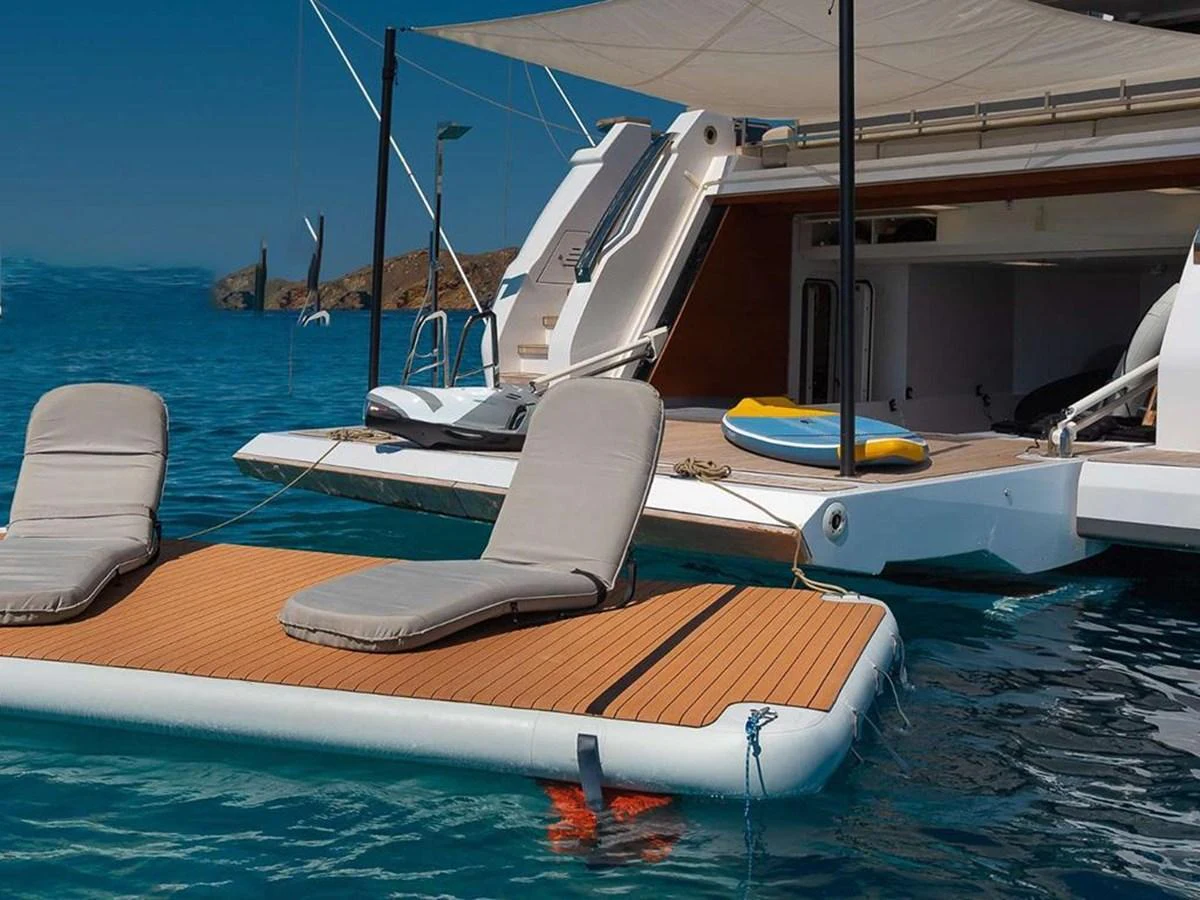 A luxurious swim platform with comfortable loungers extends the yacht's relaxation space on the water. aboard ON Yacht for Sale