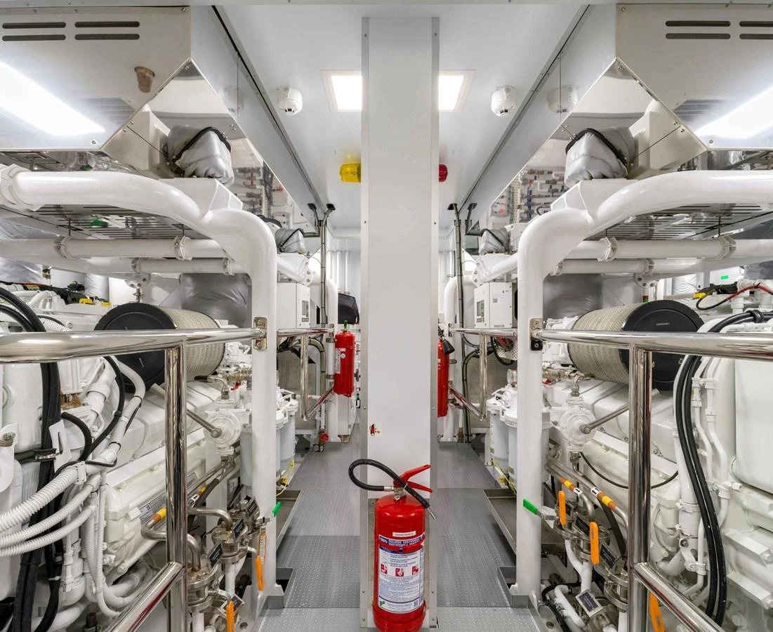 The image showcases the well-maintained engine room of the yacht, featuring powerful machinery and safety equipment. aboard SAIRU Yacht for Sale