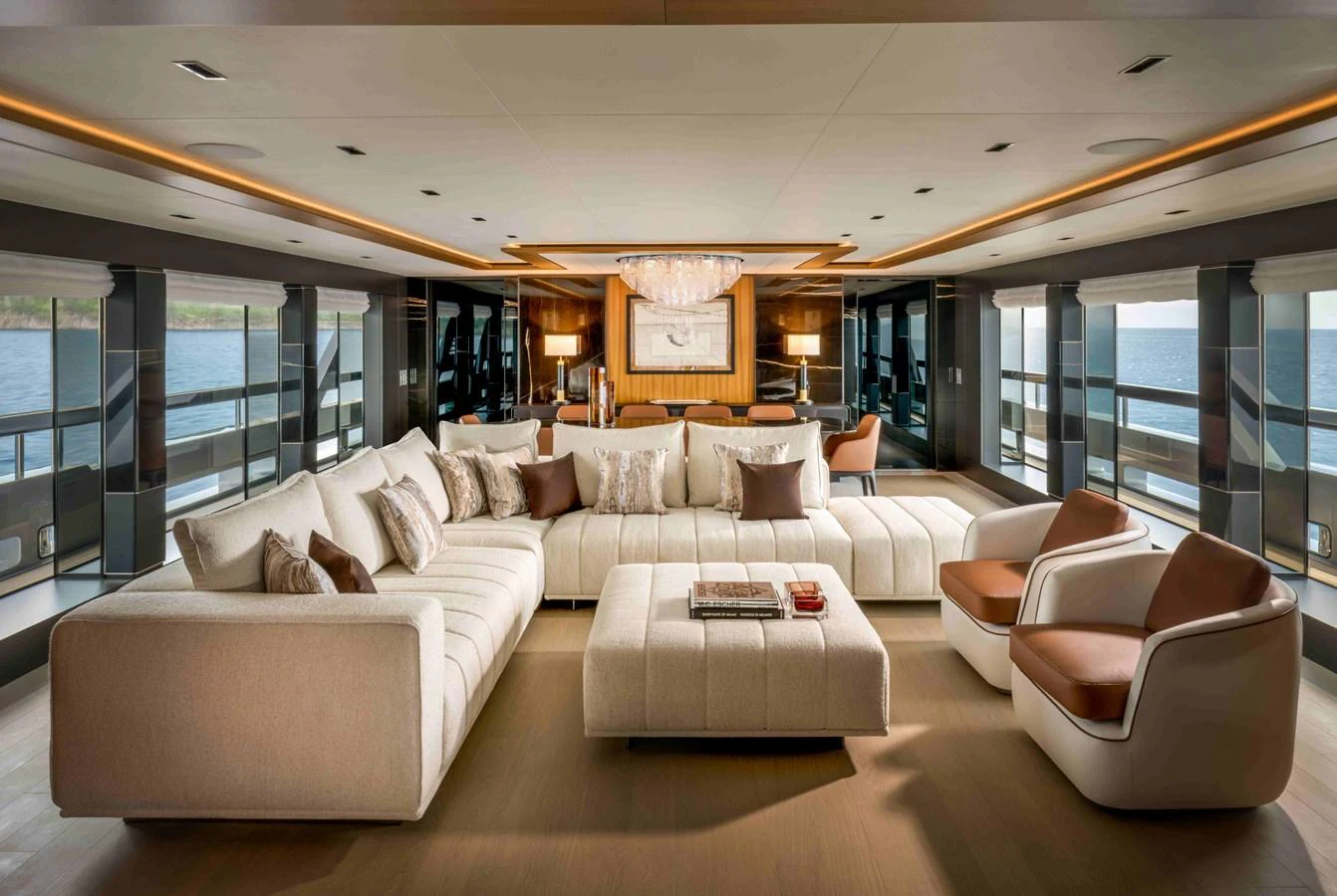 The salon features a spacious and elegant seating area with panoramic views. aboard SAIRU Yacht for Sale