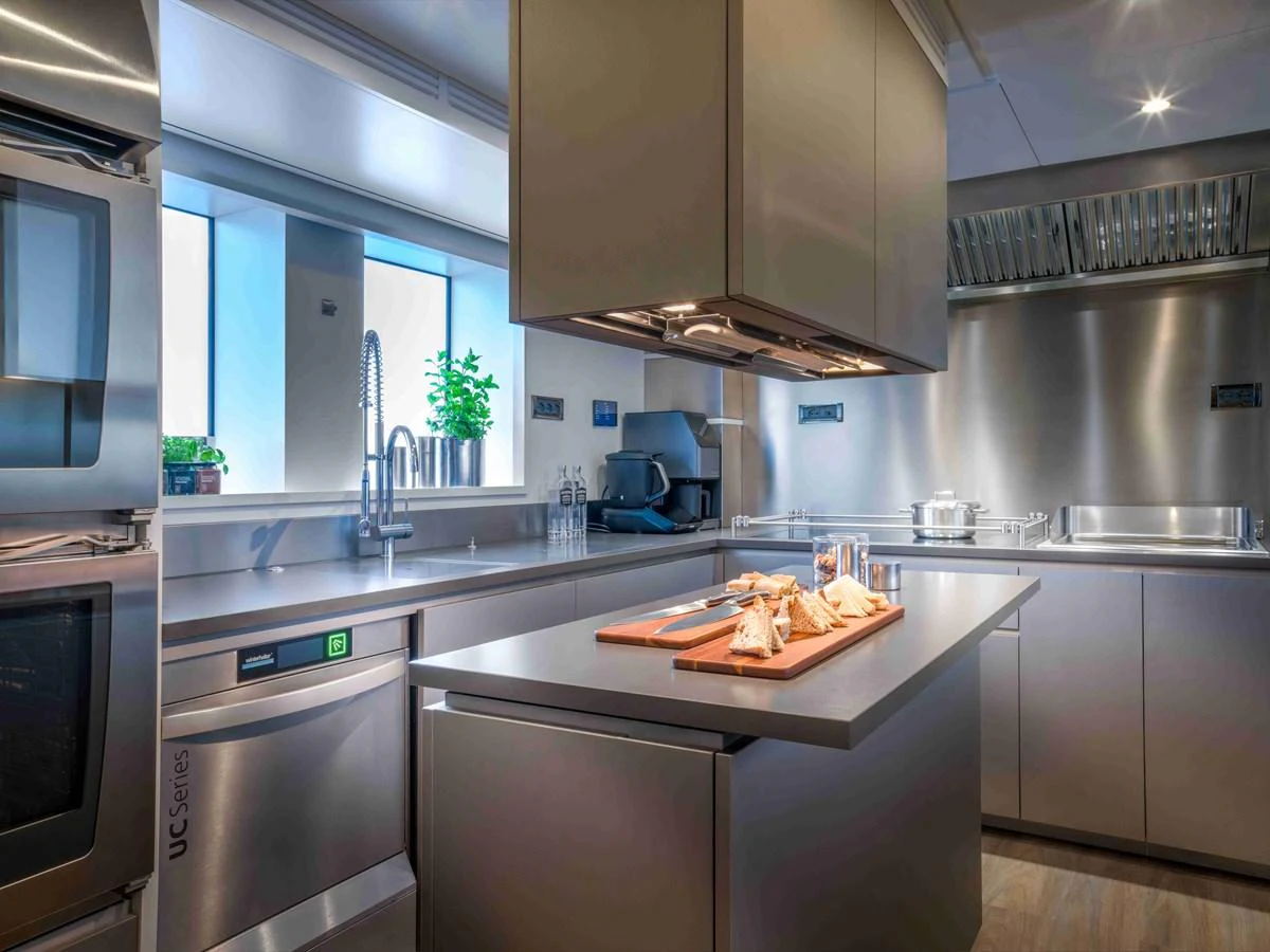 The yacht's galley is equipped with modern appliances and ample counter space, perfect for gourmet meal preparation. aboard SAIRU Yacht for Sale