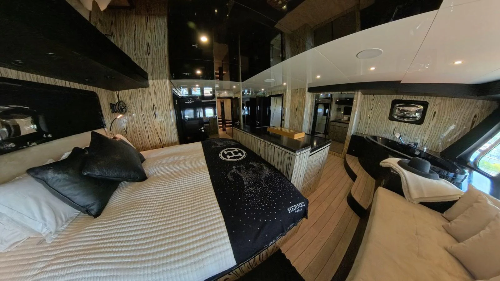 The master stateroom features luxurious bedding and modern amenities for ultimate comfort. aboard ODISEA Yacht for Sale
