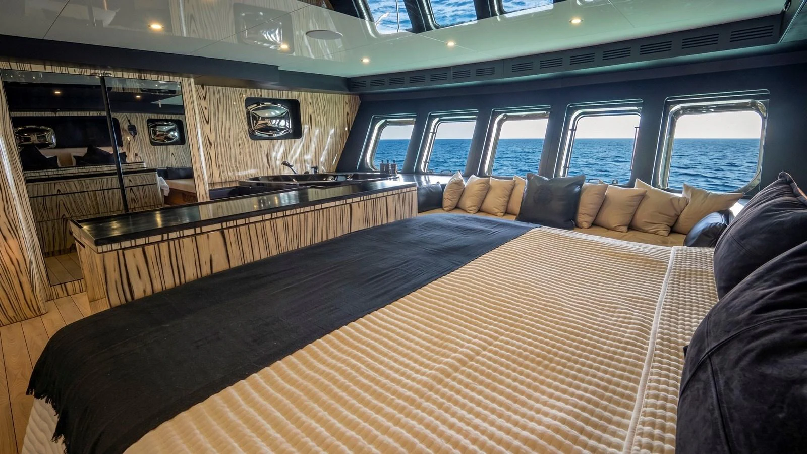 The master stateroom offers a luxurious and spacious retreat with panoramic ocean views. aboard ODISEA Yacht for Sale
