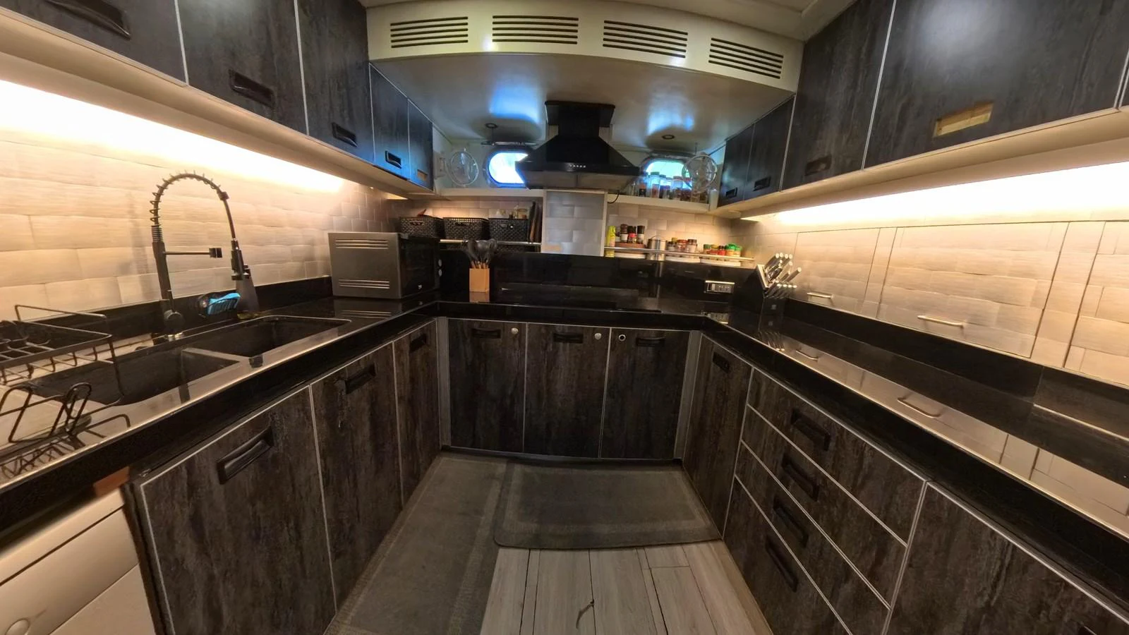 The yacht's galley features modern appliances and ample counter space for gourmet meal preparation. aboard ODISEA Yacht for Sale