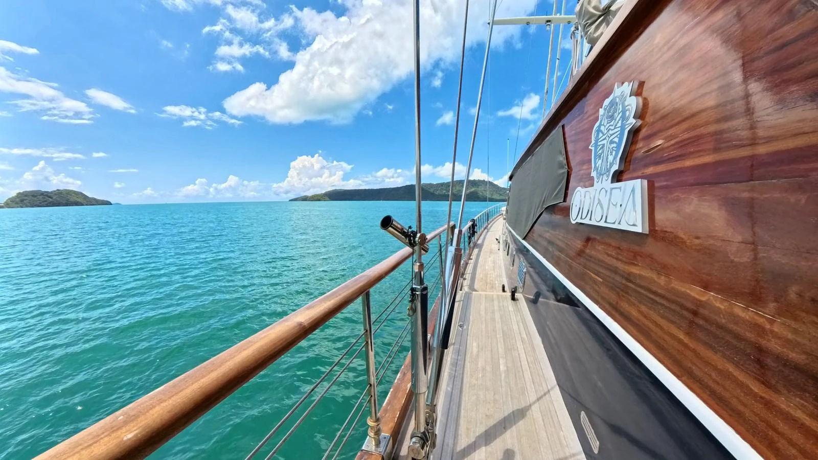 A stunning view of the yacht's deck with a beautiful seascape in the background. aboard ODISEA Yacht for Sale