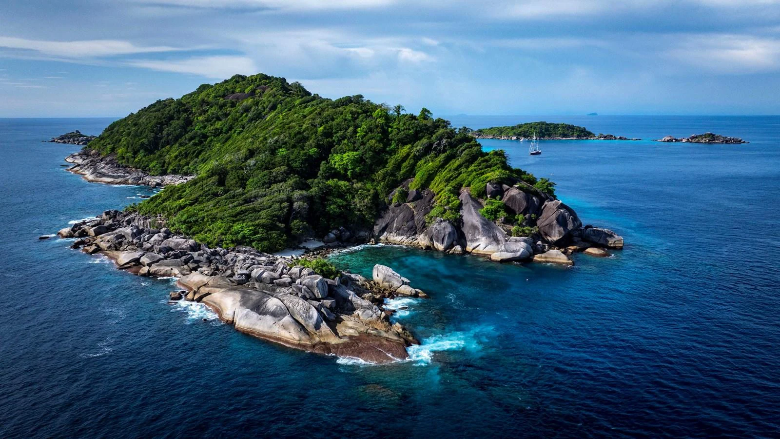 A stunning island surrounded by clear blue waters, perfect for a serene yacht getaway. aboard ODISEA Yacht for Sale