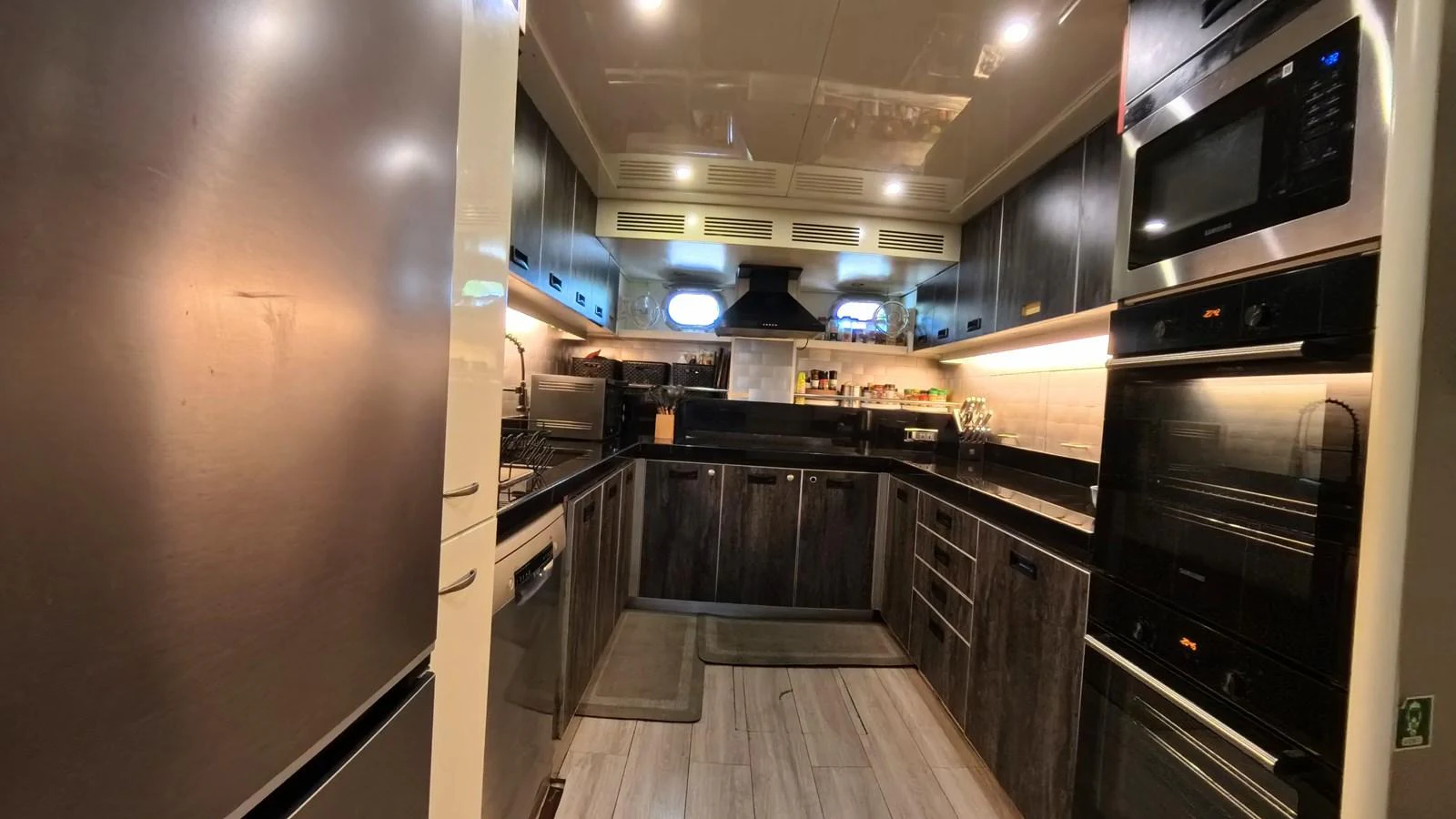 The yacht's galley is equipped with modern appliances and ample storage, providing a sleek and functional space for culinary activities. aboard ODISEA Yacht for Sale
