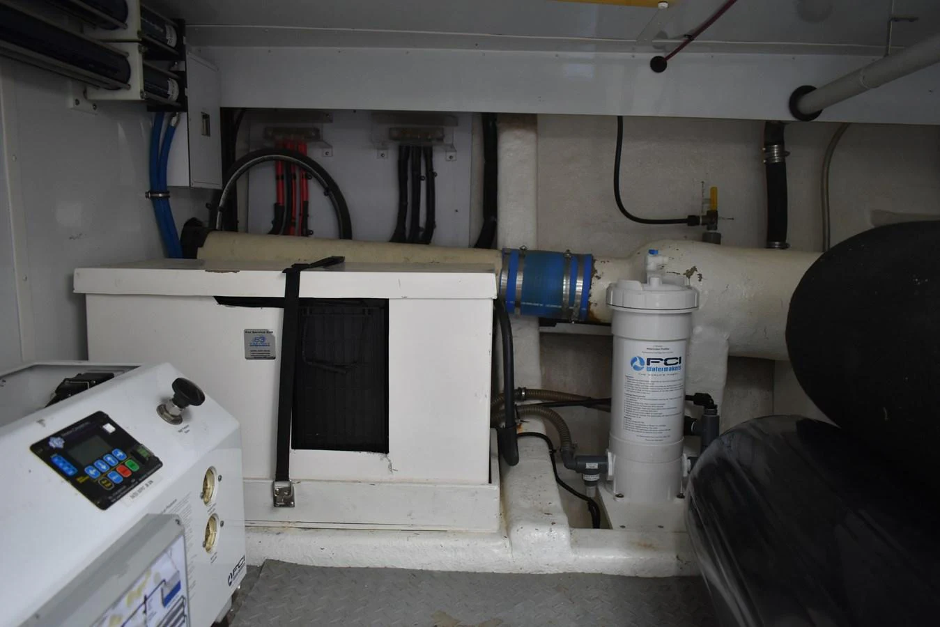 The image showcases the yacht's engine room with various mechanical components and equipment. aboard 64 OCEAN ALEXANDER Yacht for Sale