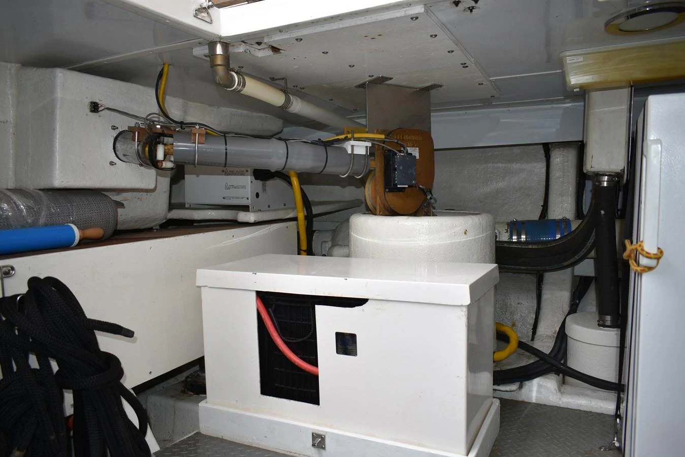 The image showcases the yacht's engine room with various mechanical components and equipment. aboard 64 OCEAN ALEXANDER Yacht for Sale