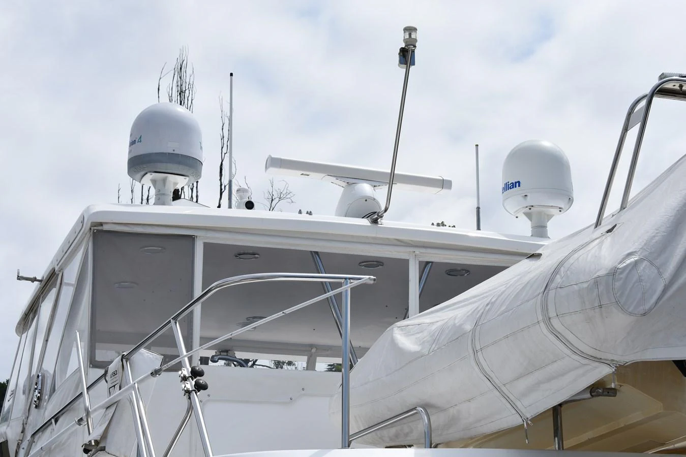 A detailed view of the yacht's upper deck showcasing radar and communication equipment. aboard 64 OCEAN ALEXANDER Yacht for Sale