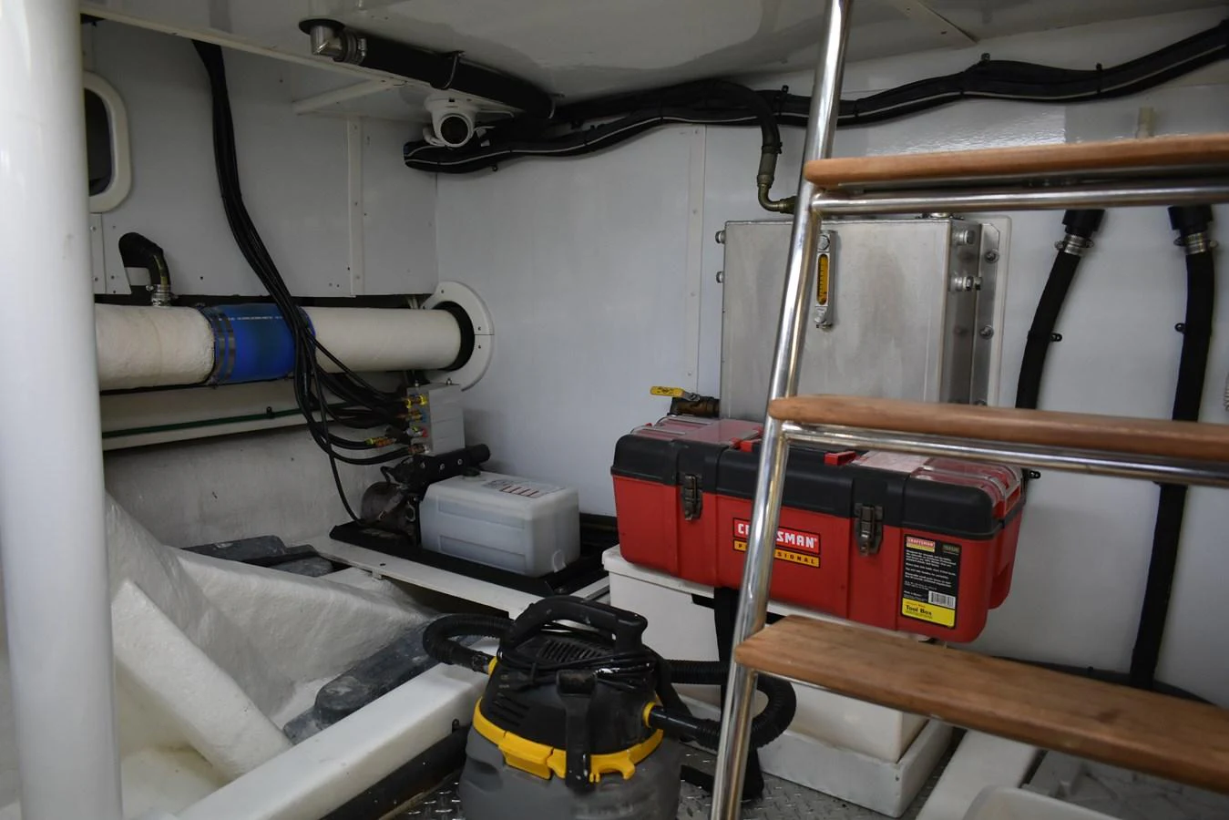 The image showcases the engine room, highlighting the technical equipment and tools stored within. aboard 64 OCEAN ALEXANDER Yacht for Sale