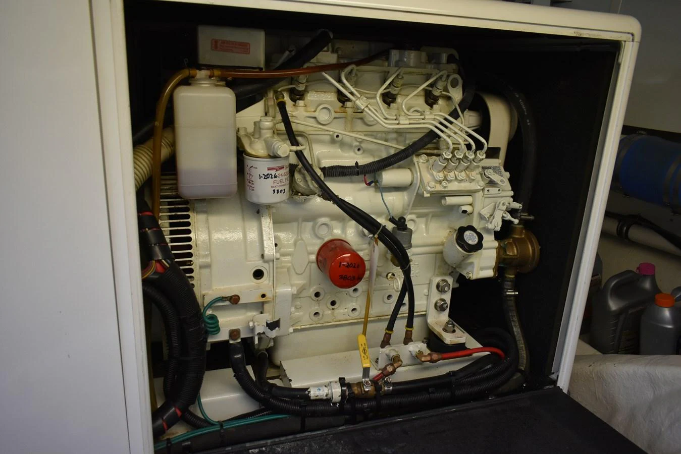The image showcases the yacht's well-maintained engine room with visible components and wiring. aboard 64 OCEAN ALEXANDER Yacht for Sale