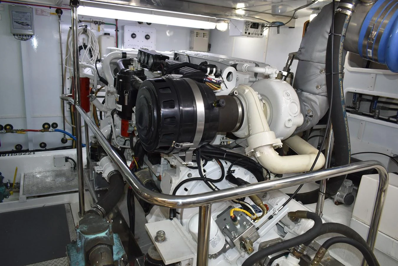 The image showcases the yacht's well-maintained engine room with advanced machinery. aboard 64 OCEAN ALEXANDER Yacht for Sale