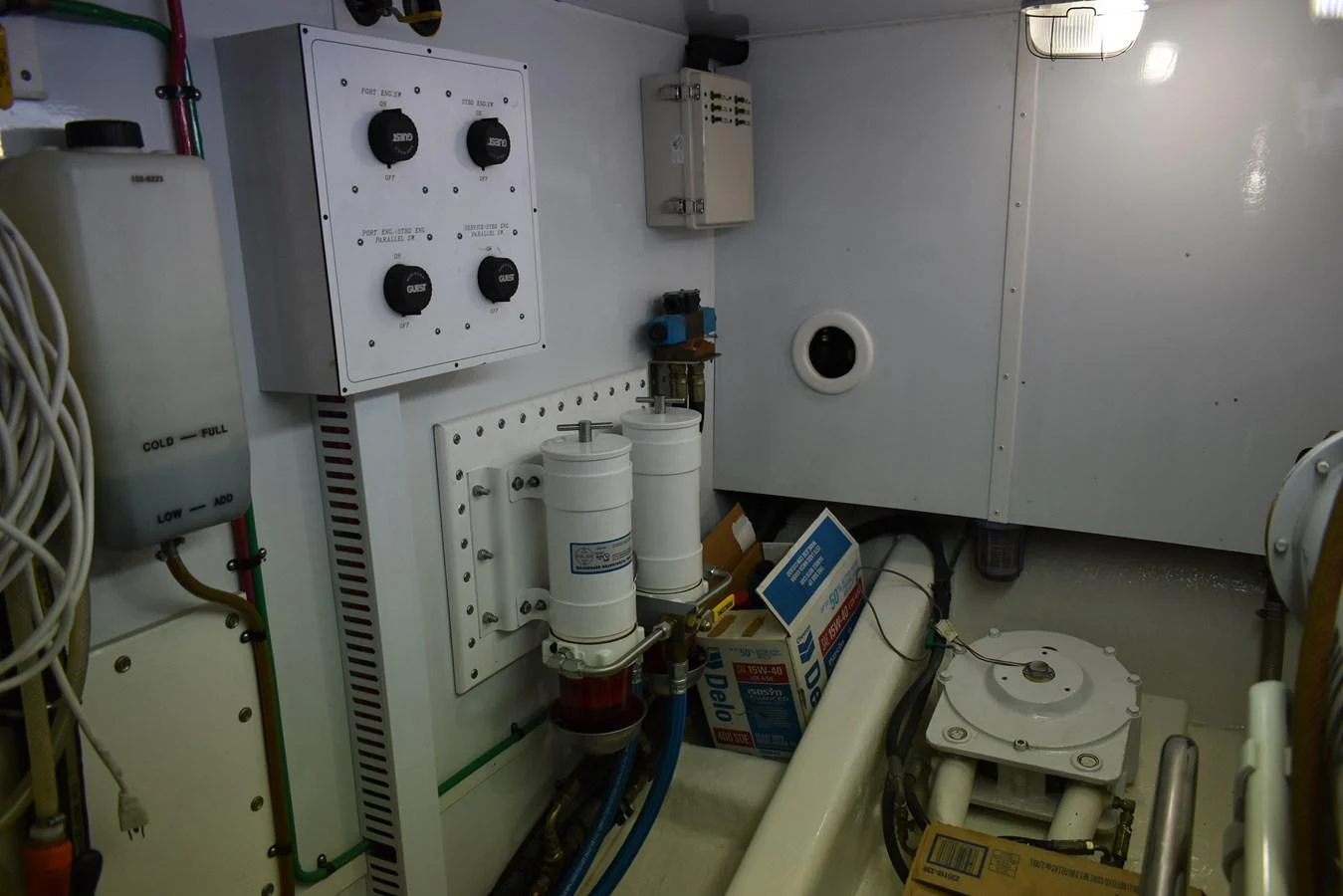 A detailed view of the yacht's engine room showcasing various technical components and equipment. aboard 64 OCEAN ALEXANDER Yacht for Sale