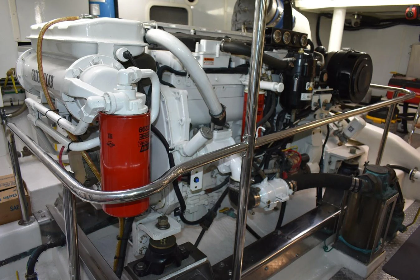 The image showcases the well-maintained engine room of the yacht, highlighting its mechanical components. aboard 64 OCEAN ALEXANDER Yacht for Sale