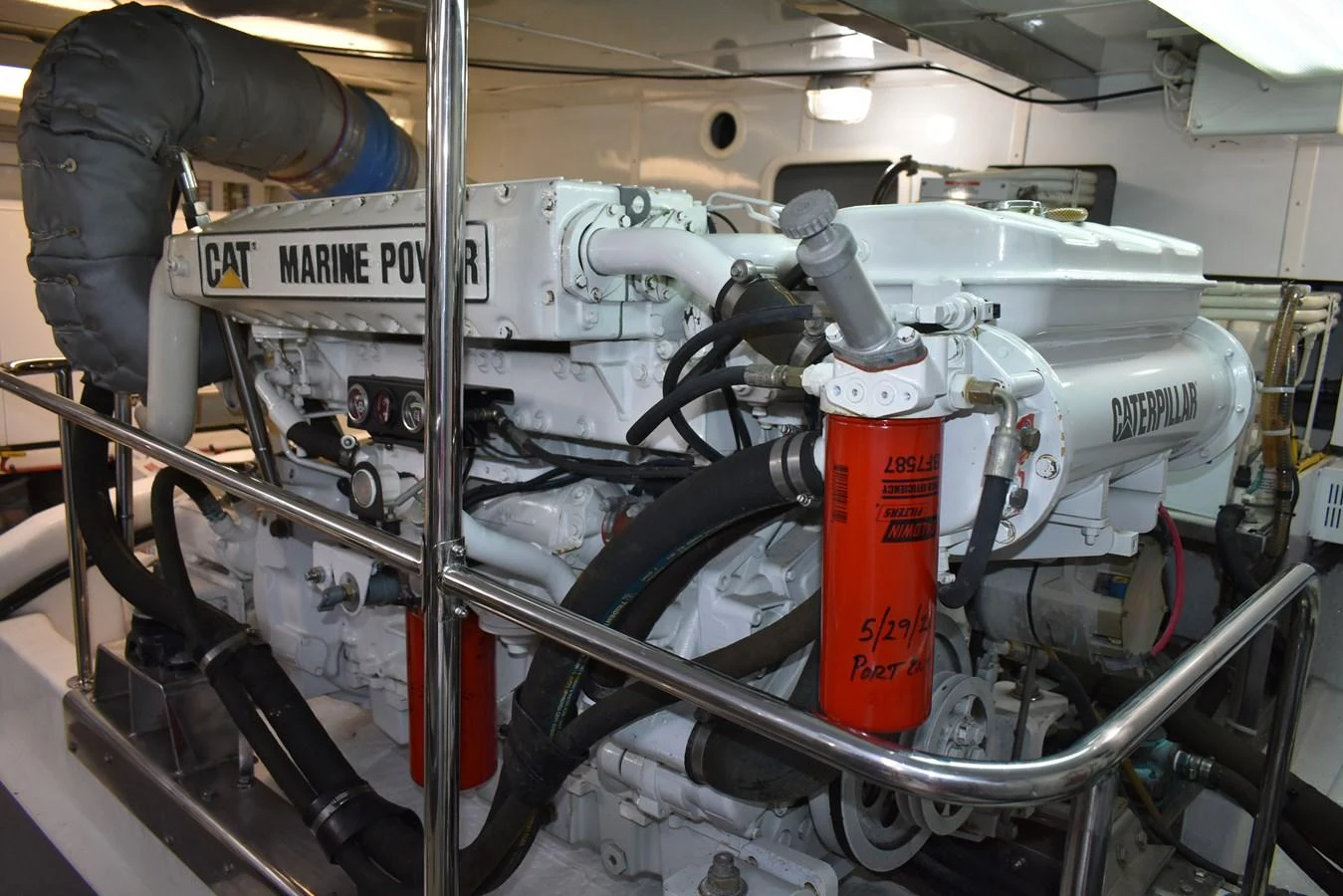 The engine room showcases powerful marine engines and well-maintained equipment. aboard 64 OCEAN ALEXANDER Yacht for Sale