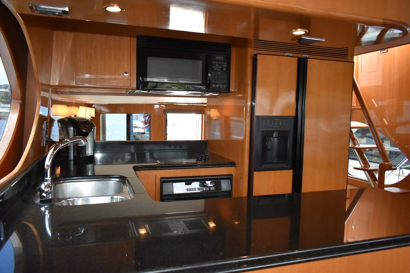 The galley features modern appliances and sleek finishes, perfect for gourmet cooking at sea. aboard 64 OCEAN ALEXANDER Yacht for Sale