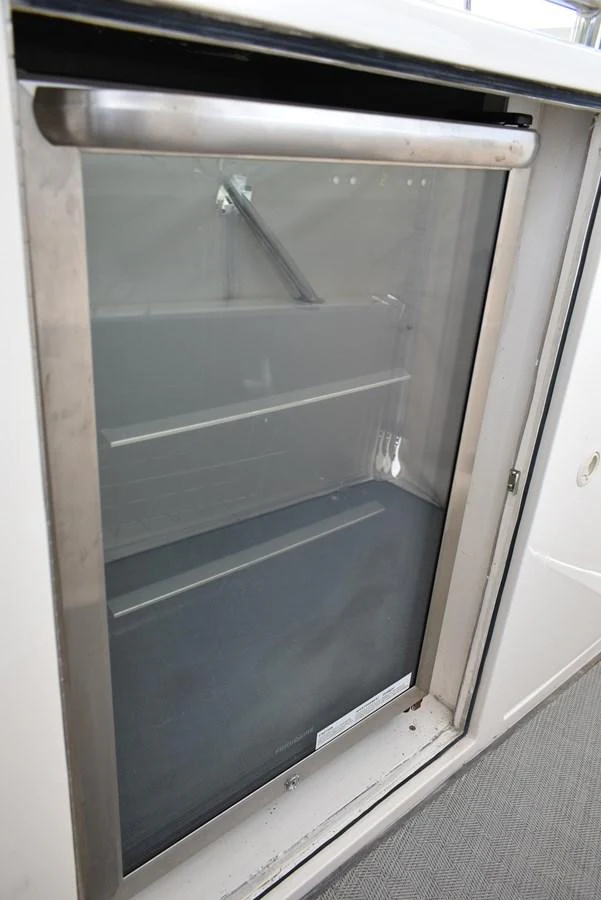 A close-up view of a built-in refrigerator on the yacht. aboard 64 OCEAN ALEXANDER Yacht for Sale
