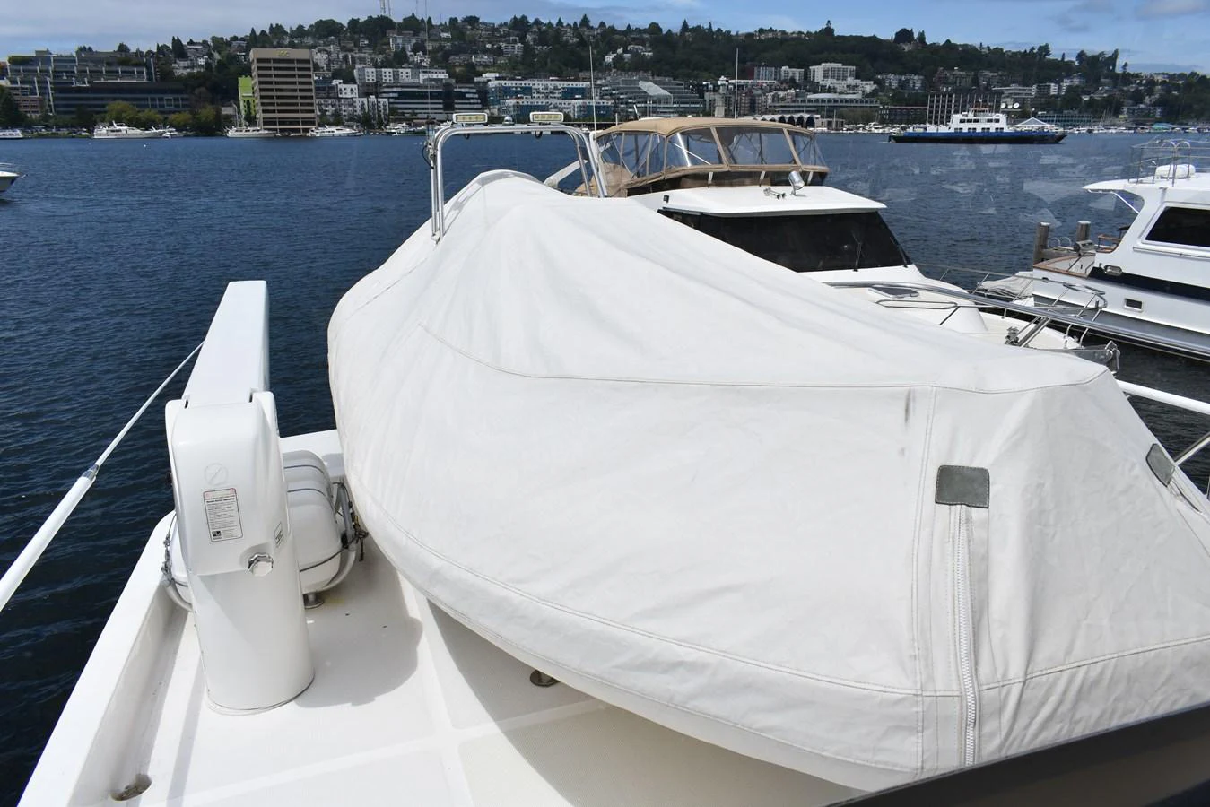 A covered tender is securely stored on the deck of the yacht. aboard 64 OCEAN ALEXANDER Yacht for Sale
