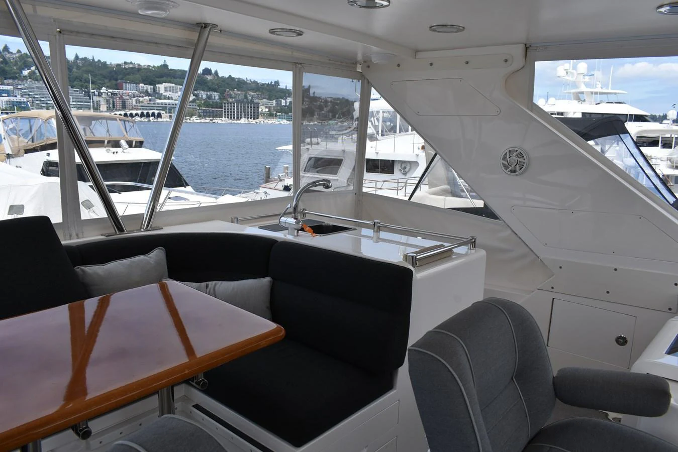 The yacht's salon offers a comfortable seating area with a view of the marina. aboard 64 OCEAN ALEXANDER Yacht for Sale