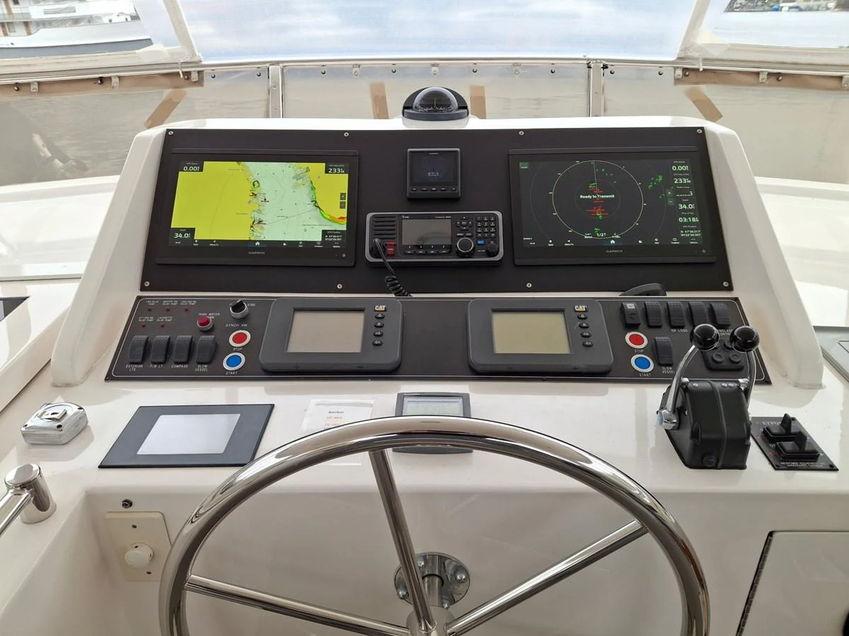 The helm station features advanced navigation and control systems for a seamless sailing experience. aboard 64 OCEAN ALEXANDER Yacht for Sale