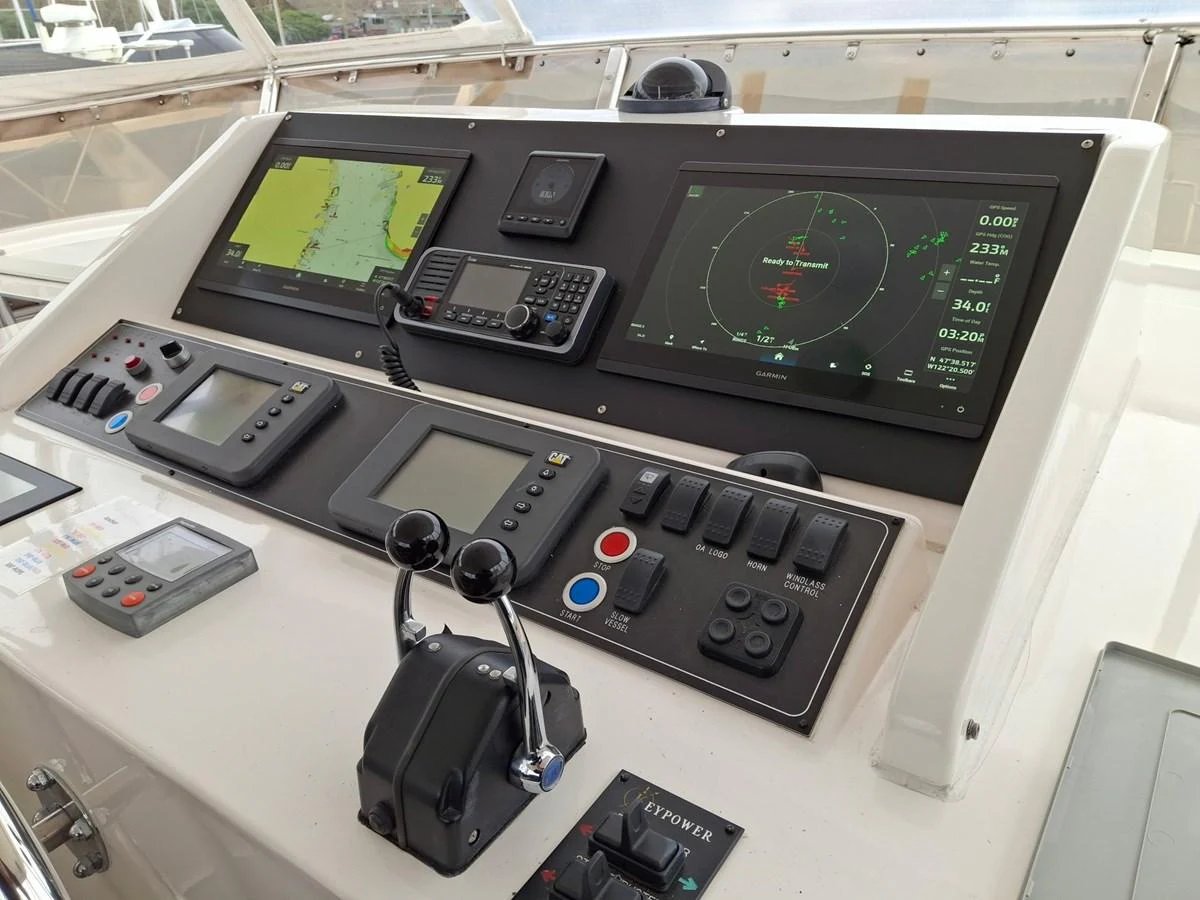 The helm station is equipped with advanced navigation and control systems. aboard 64 OCEAN ALEXANDER Yacht for Sale