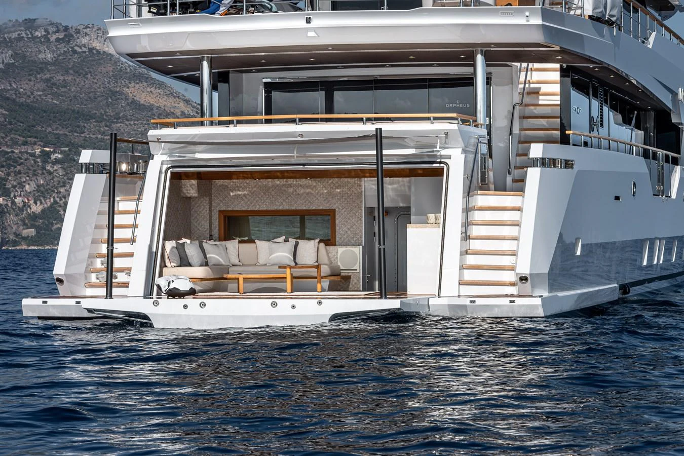 The yacht's aft deck features a luxurious lounging area with direct access to the water. aboard NUMARINE 37XP#22 Yacht for Sale