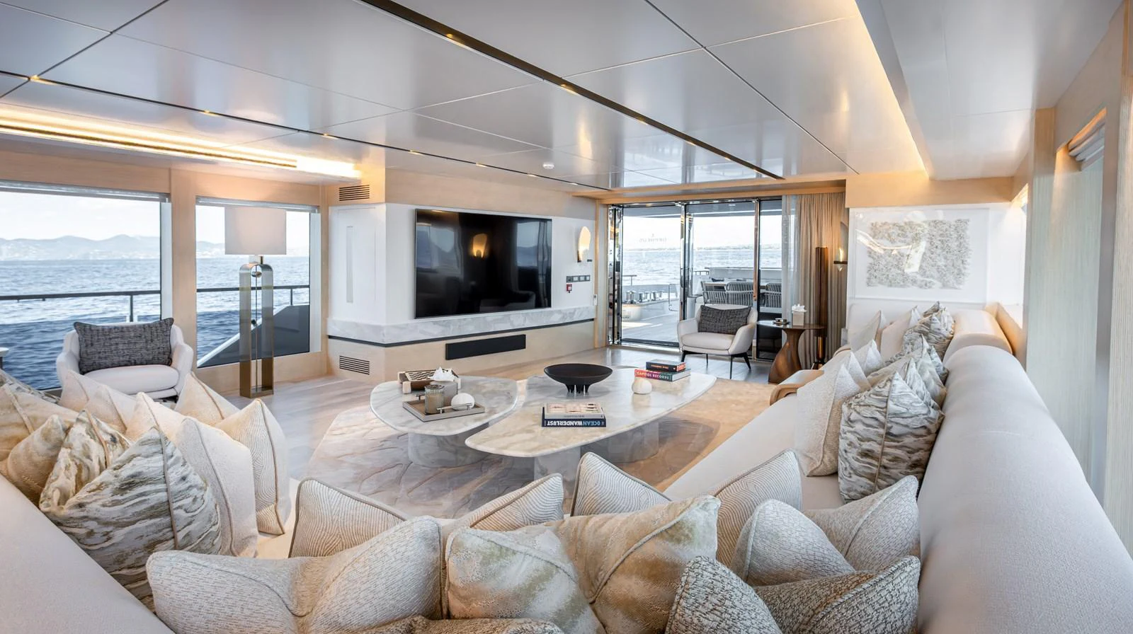 The spacious salon offers a luxurious and comfortable setting with panoramic ocean views. aboard NUMARINE 37XP#22 Yacht for Sale