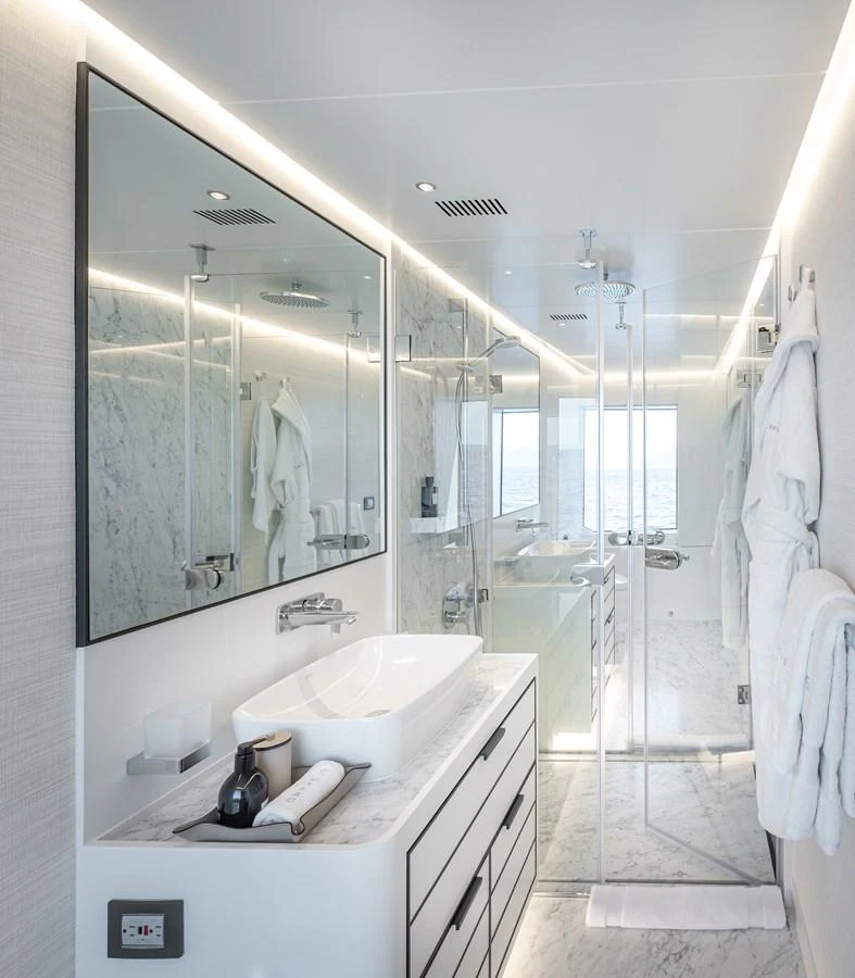 The yacht's bathroom features a sleek and modern design with marble accents and ample lighting. aboard NUMARINE 37XP#22 Yacht for Sale