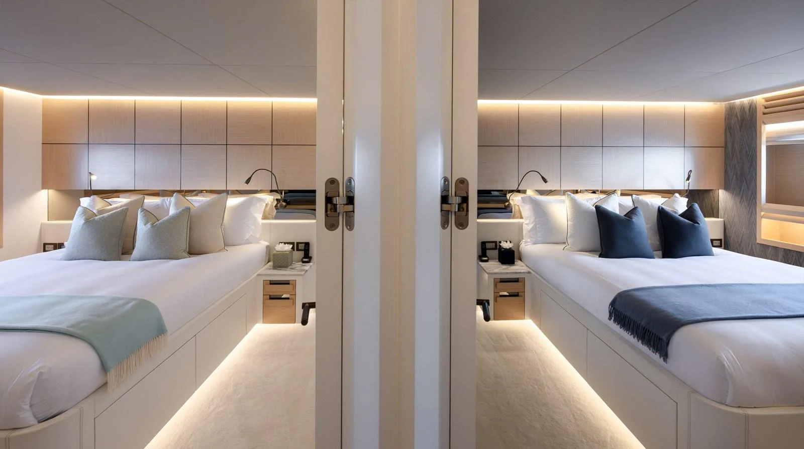 The image showcases a luxurious stateroom with twin beds and elegant lighting. aboard NUMARINE 37XP#22 Yacht for Sale
