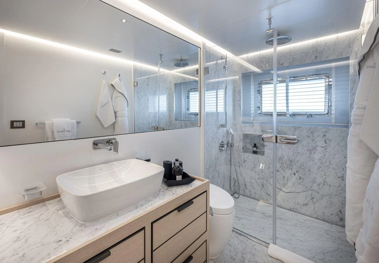 The yacht's bathroom features elegant marble surfaces and modern fixtures, creating a luxurious and serene atmosphere. aboard NUMARINE 37XP#22 Yacht for Sale