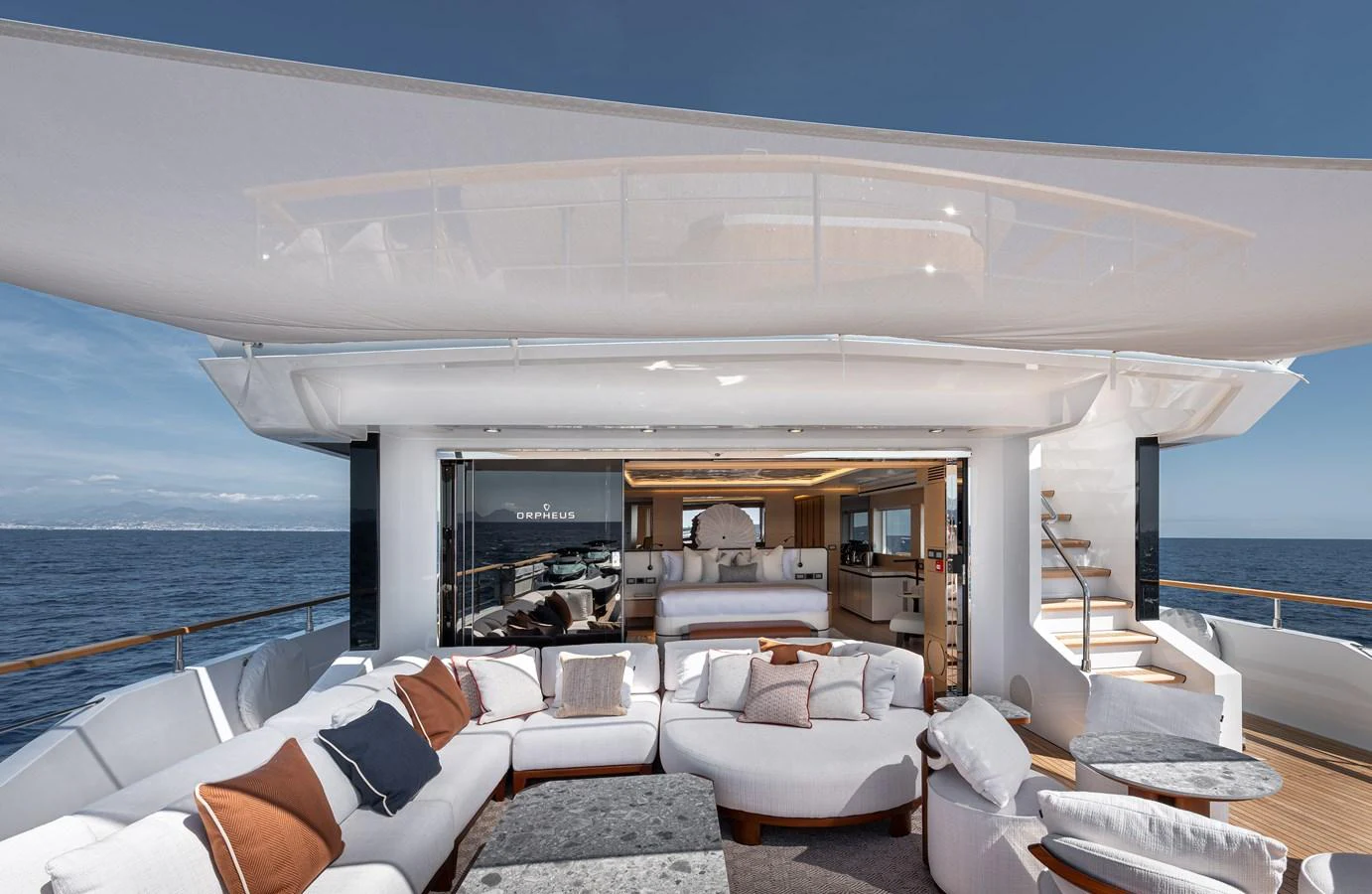 The aft deck features luxurious seating with a seamless transition to the interior living space. aboard NUMARINE 37XP#22 Yacht for Sale