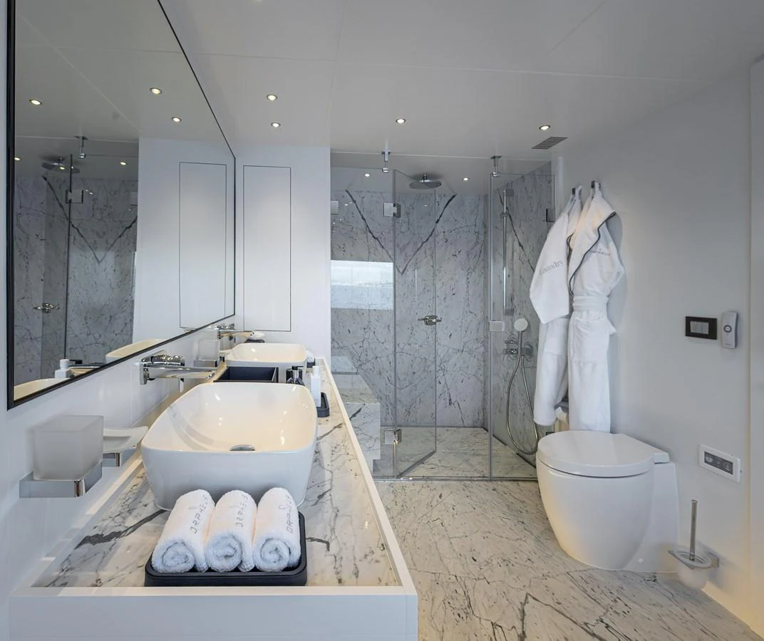 The yacht's bathroom features luxurious marble finishes and modern amenities. aboard NUMARINE 37XP#22 Yacht for Sale