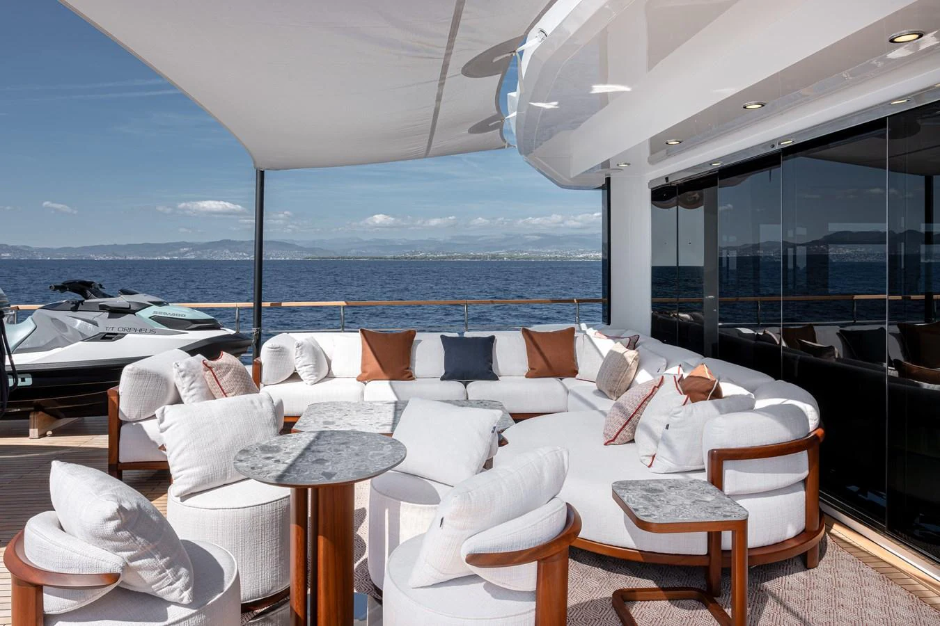 The aft deck features a luxurious seating area with a stunning ocean view. aboard NUMARINE 37XP#22 Yacht for Sale