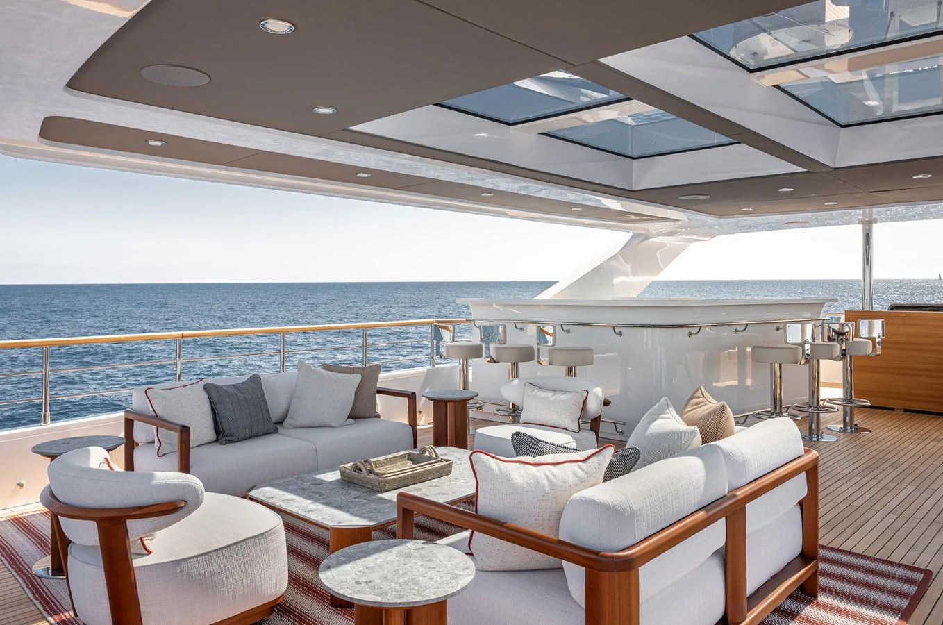 The aft deck features a luxurious seating area with panoramic ocean views. aboard NUMARINE 37XP#22 Yacht for Sale