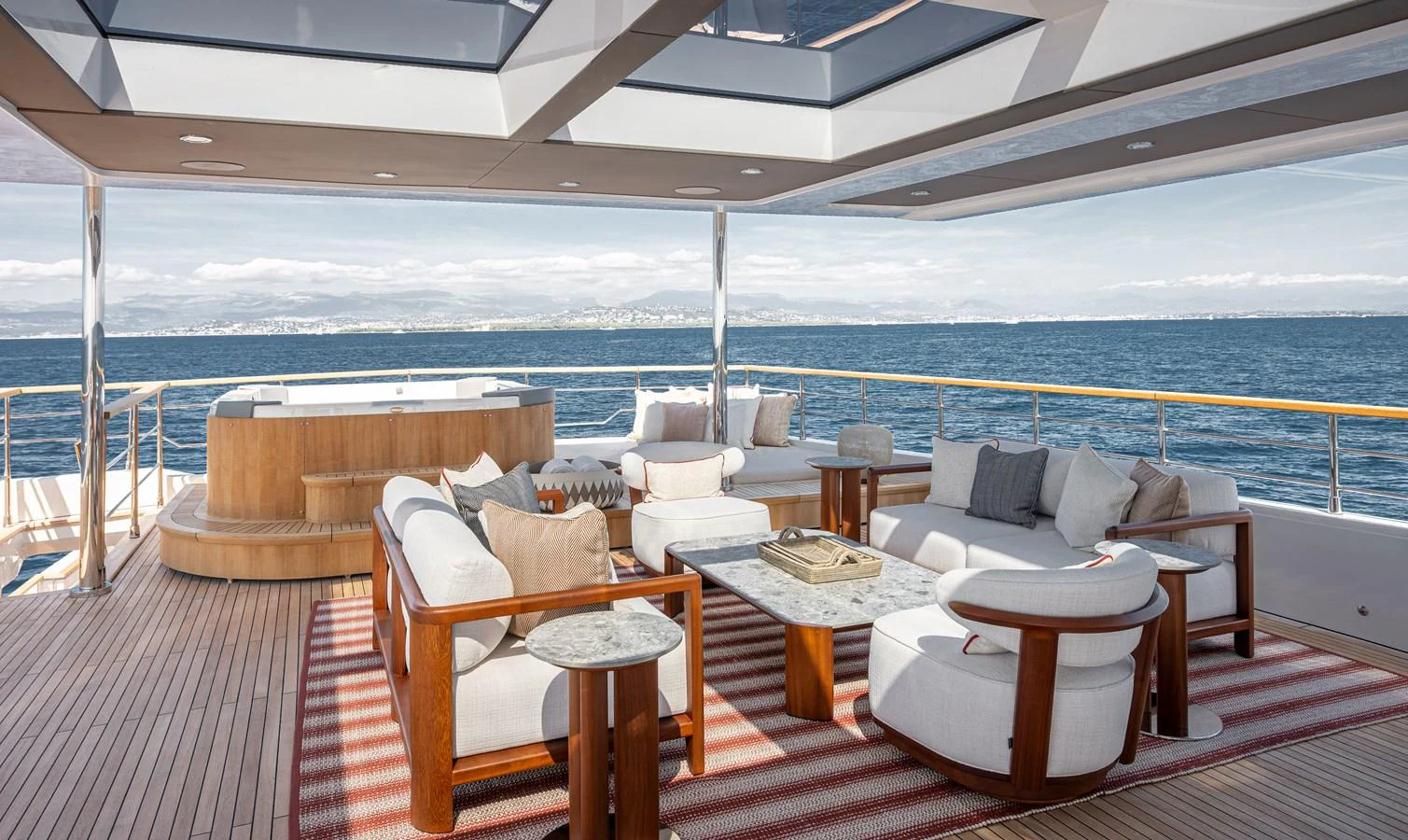 The aft deck features luxurious seating and a jacuzzi with panoramic ocean views. aboard NUMARINE 37XP#22 Yacht for Sale