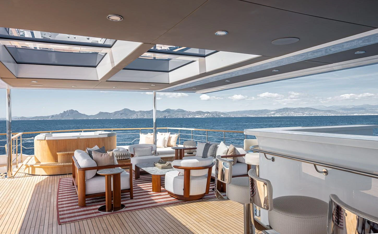 The aft deck offers a luxurious outdoor seating area with panoramic ocean views. aboard NUMARINE 37XP#22 Yacht for Sale