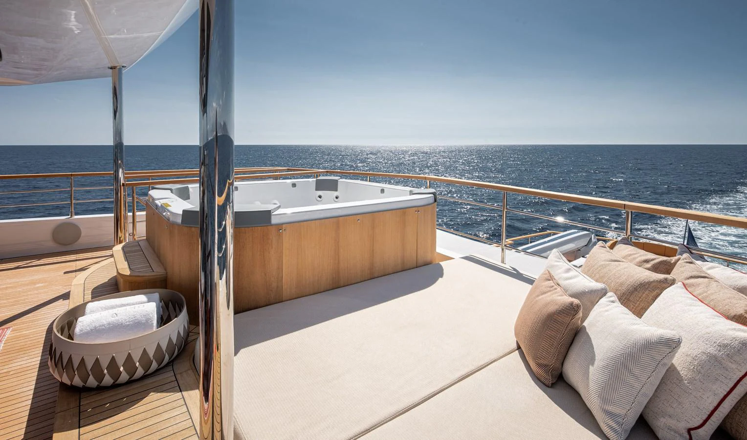 The sundeck features a luxurious jacuzzi and a comfortable lounging area with a stunning ocean view. aboard NUMARINE 37XP#22 Yacht for Sale