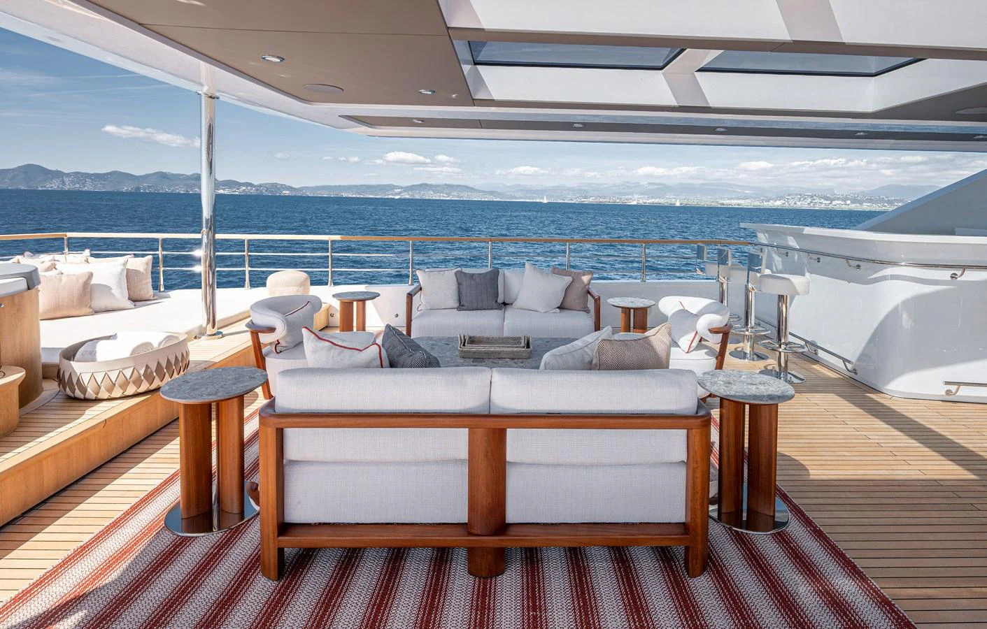 The aft deck features a luxurious outdoor seating area with stunning ocean views. aboard NUMARINE 37XP#22 Yacht for Sale