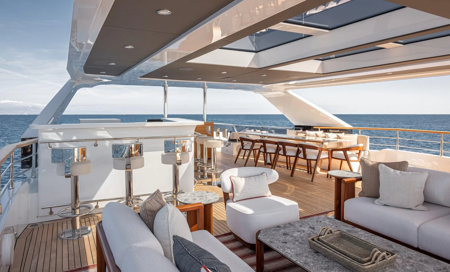 The sundeck offers a luxurious outdoor living space with ample seating and dining areas, perfect for relaxation and entertainment. aboard NUMARINE 37XP#22 Yacht for Sale