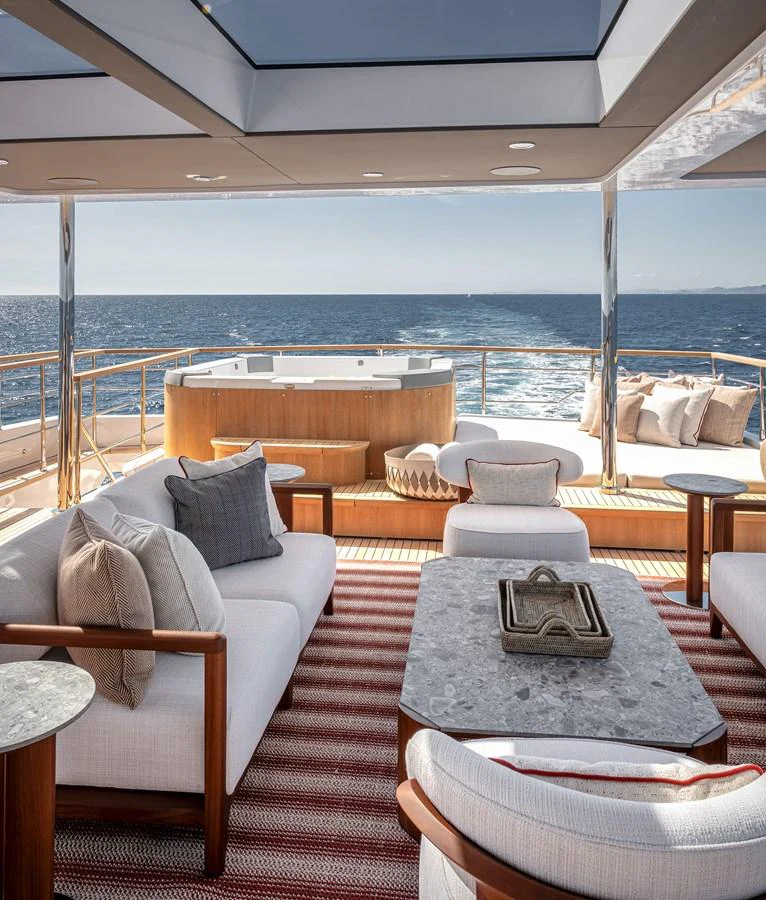The aft deck features luxurious seating and a jacuzzi with stunning ocean views. aboard NUMARINE 37XP#22 Yacht for Sale