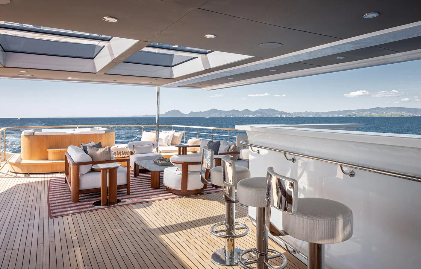 The sundeck offers a luxurious outdoor seating area with panoramic ocean views. aboard NUMARINE 37XP#22 Yacht for Sale