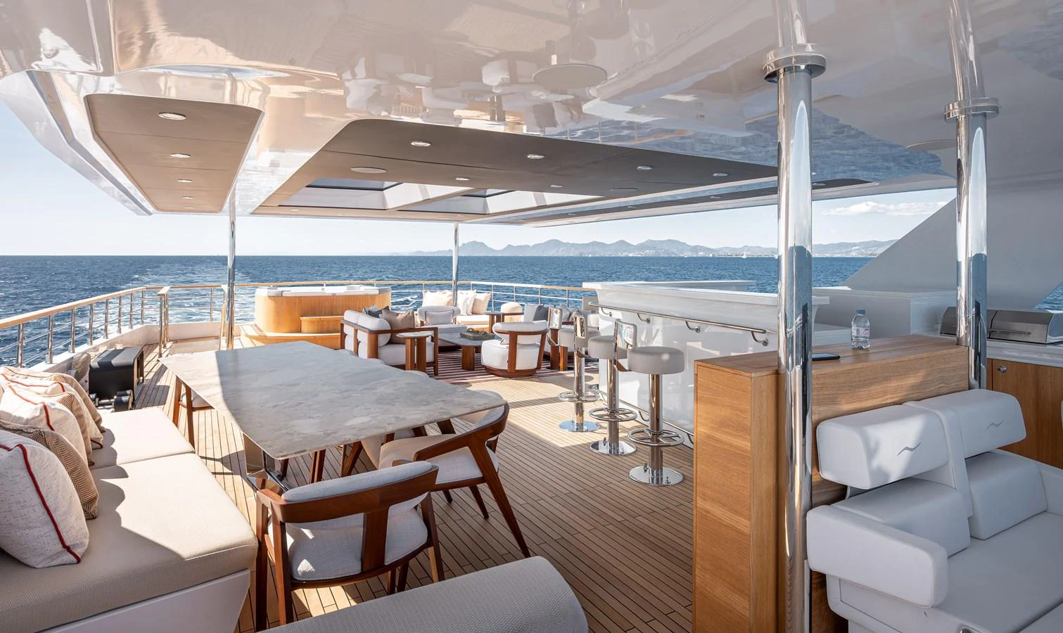 The sundeck offers a luxurious outdoor living space with ample seating and stunning ocean views. aboard NUMARINE 37XP#22 Yacht for Sale