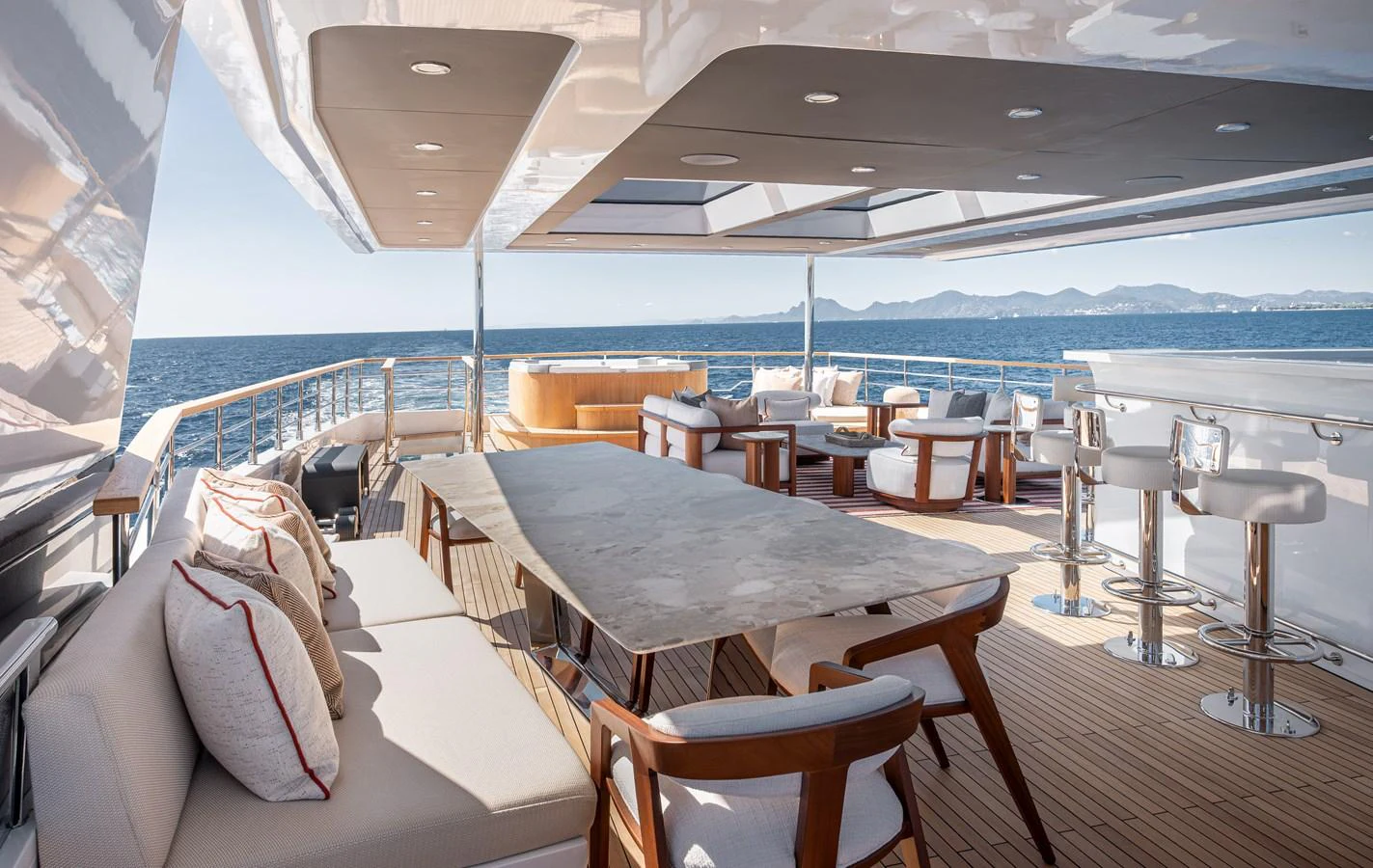 The aft deck offers a spacious and luxurious outdoor dining and lounging area with stunning sea views. aboard NUMARINE 37XP#22 Yacht for Sale