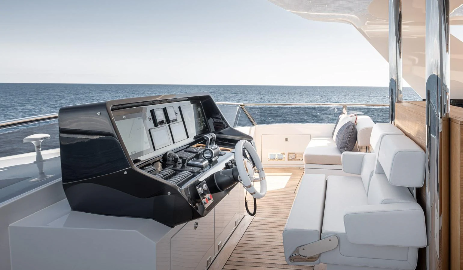 The helm station offers a sleek and modern design with a comfortable seating area and advanced navigation equipment. aboard NUMARINE 37XP#22 Yacht for Sale