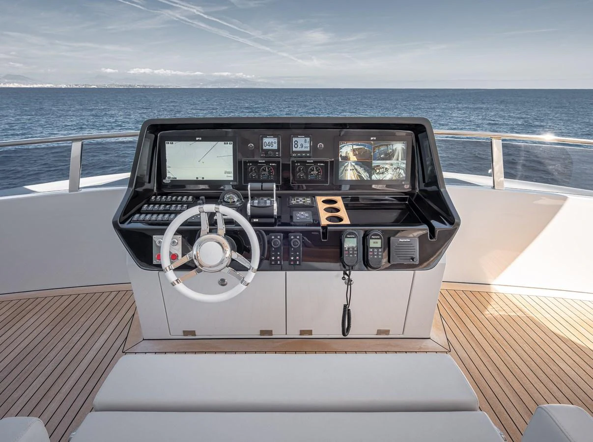 The helm station offers a commanding view of the open sea with state-of-the-art navigation equipment. aboard NUMARINE 37XP#22 Yacht for Sale